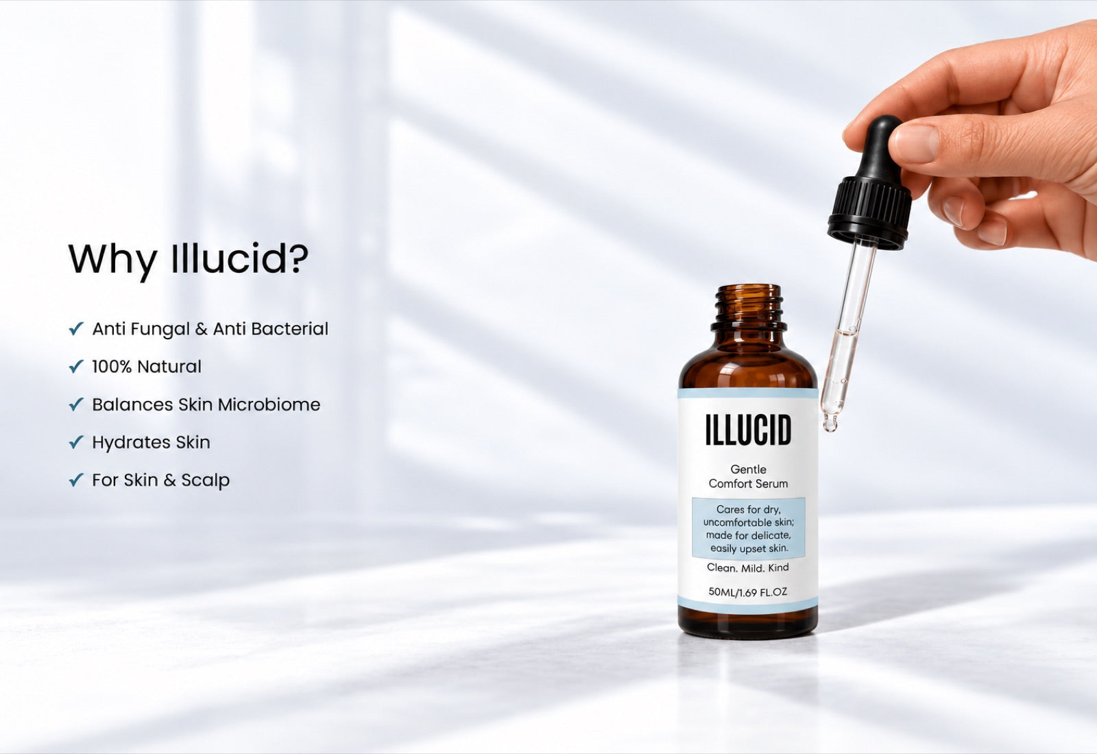 A hand lifting the dropper from a bottle of Illucid serum